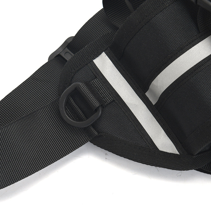 Close-up of a black waist bag with a strap and buckle on a white background